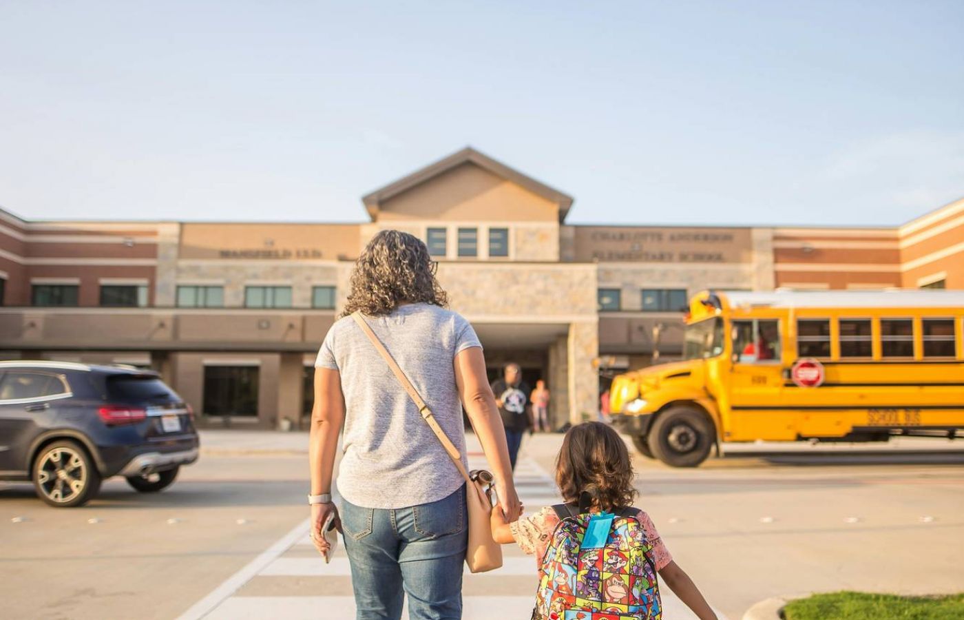 Mom and child walking into school in the Minisink Valley School district